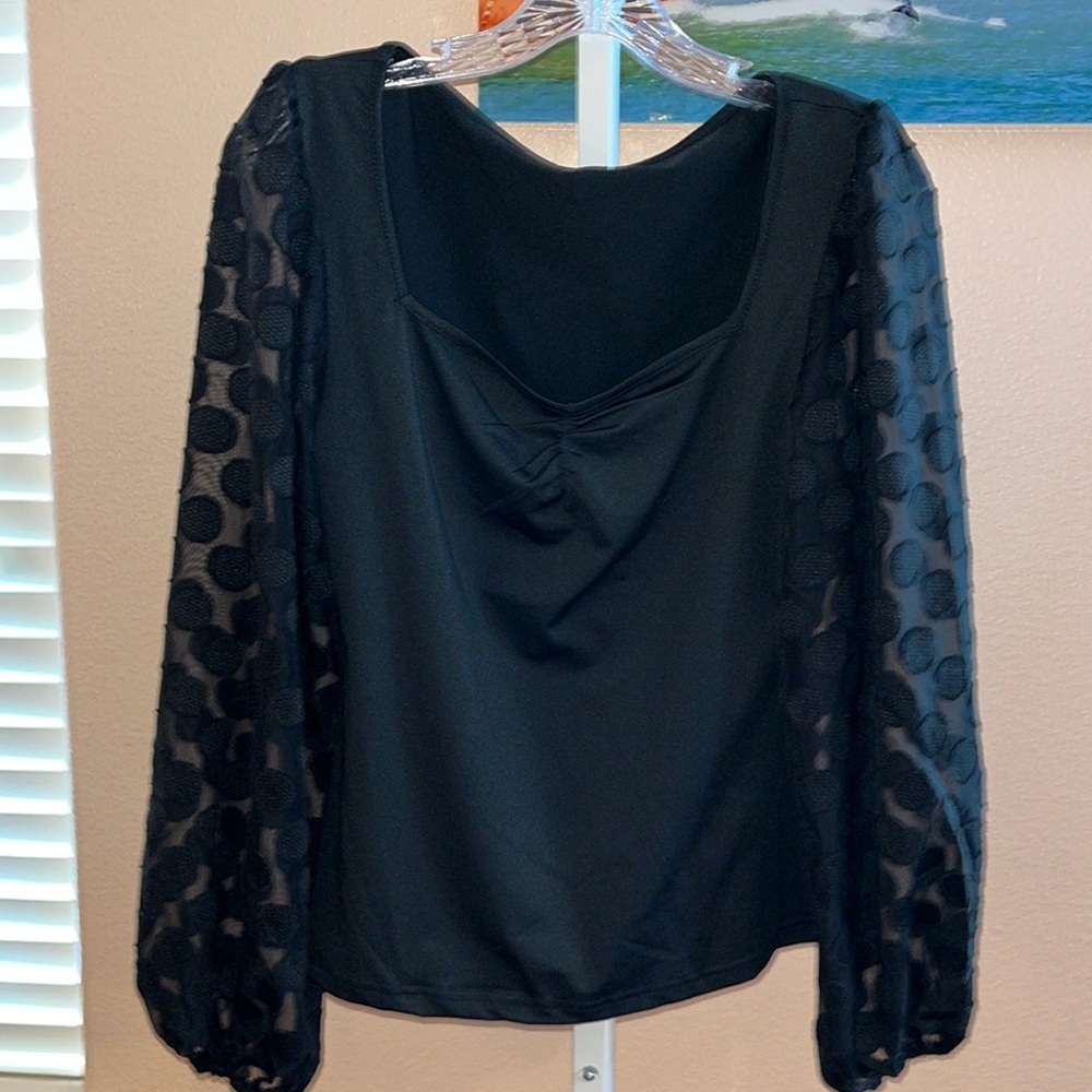 Black long sleeve size large top pit to pit 17” stretches to 22”